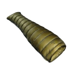 Olive green, quilted sleeping bag rolled up for packing and ready to store.
