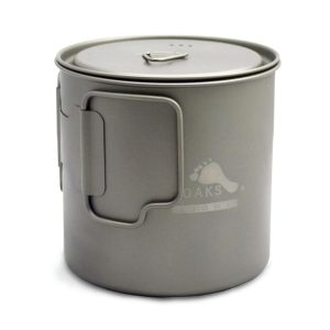 Gray metal camping mug with a hinged lid and fold-out side handle on a white background.