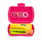 Open pink travel dental kit with a yellow 'BE YOU' toothpaste tube, a green toothbrush, and a clear dental floss tool arranged inside the case.
