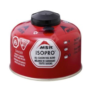Red MSR Isopro all-season fuel blend canister with black screw cap and warning icons on the side (flammable)