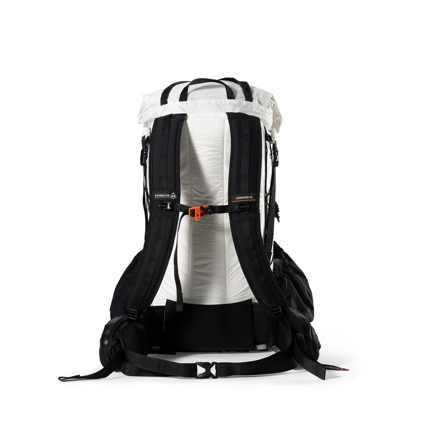 Back view of a black-and-white hiking backpack with padded shoulder straps, a chest strap, and hip belt.