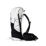 Side view of a white and black hiking backpack with bungee cords, padded shoulder straps, and a waist belt.