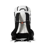 Back view of a white hiking backpack with black padded shoulder straps and an orange sternum strap.