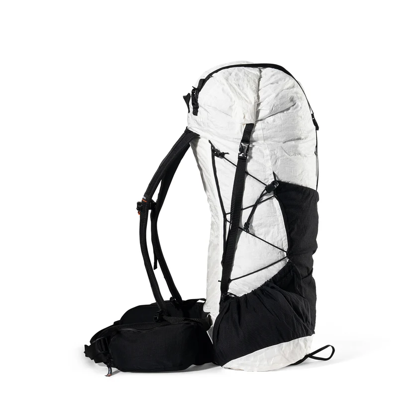 Ultralight hiking backpack with white top and black bottom, shown from the side with external bungee cords and mesh pocket.