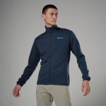 Montane Mens Zepher Jacket Eclipse Blue 02 Man wearing a navy Montane zip-up jacket with high collar, standing against a gray background.