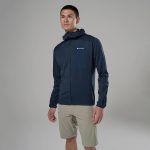 Montane Mens Zepter Hooded Fleece Jacket Eclipse Blue 02 Man modeling outdoor apparel: navy Montane jacket with zippered chest pocket, standing against neutral gray backdrop.