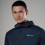 Montane Mens Zepter Hooded Fleece Jacket Eclipse Blue 05 Portrait of a man wearing a navy Montane jacket, facing the camera with a neutral expression.