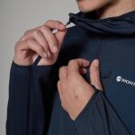 Montane Mens Zepter Hooded Fleece Jacket Eclipse Blue 06 Person's hands zipping up a dark blue jacket with a Montane tag visible on the chest. More than one layer being adjusted at the zipper area.